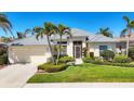 Charming single-story home boasting manicured lawn and tropical landscaping in a desirable neighborhood at 863 Macaw Cir, Venice, FL 34285