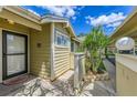 Inviting home entrance with well-kept landscaping and charming architectural details at 3008 Sail Pointe Cir # 2C, Venice, FL 34293