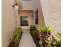 Inviting entrance showcasing lush landscaping and a well-maintained walkway, ensuring a warm welcome at 1007 Gondola Park Dr # 1007, Venice, FL 34292