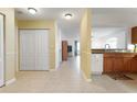 Bright hallway featuring tile floors and ample closet space, offering both style and functionality at 1007 Gondola Park Dr # 1007, Venice, FL 34292