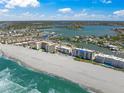 Aerial view of Bahia Mar building on the beach with stunning views of the Gulf and coastline at 1100 Tarpon Center Dr # 104, Venice, FL 34285