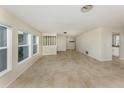 Bright living space with tile floors, large windows, and an open and airy feel at 1234 Pinebrook Way, Venice, FL 34285