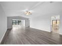 Bright living room with modern flooring and ceiling fan at 131 Sandstone Cir, Venice, FL 34293
