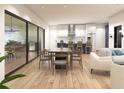 Open concept living space with a dining area, a kitchen, and sliding doors to the outdoor space at 1804 Nimbus Dr, North Port, FL 34287