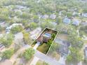 Beautiful aerial view of the property, showcasing its backyard pool, waterfront views, and neighborhood at 214 Whispering Oaks Ct, Sarasota, FL 34232