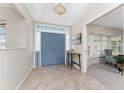 Home foyer featuring tiled floors, double doors with side lights and transom, and neutral paint colors at 351 Eden Dr, Englewood, FL 34223