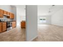 Bright, open living room showcases neutral tile, an abundance of natural light and modern fixtures at 3590 Lookout Ln, North Port, FL 34288