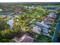 Beautifully landscaped homes overlooking the golf course and water feature in the community at 48 Grande Fairway, Englewood, FL 34223