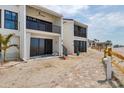 Beachside condos showcase private balconies and entrances, enhanced by a picturesque wooden pathway at 500 Park S Blvd # 62, Venice, FL 34285