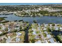 Stunning aerial view showcasing the property's location on a canal with access to a bay and the Gulf of Mexico at 504 Buena Vista Dr, Nokomis, FL 34275