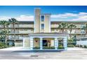Entrance to a well-maintained multi-story condo building with covered area at 839 Wexford Blvd # 839, Venice, FL 34293