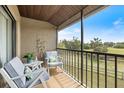 Relaxing balcony features comfortable seating and scenic views of the outdoors at 925 Capri Isles Blvd # 4, Venice, FL 34292