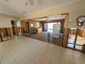 Partially renovated living room showing tile floor, and open floor plan at 926 Inlet Cir, Venice, FL 34285