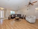 Inviting living room with hardwood floors, comfortable seating, and plenty of natural light at 1340 Olympia Rd, Venice, FL 34293