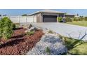 Charming home featuring a well-maintained yard with lovely landscaping and a spacious driveway at 1503 Marlin St, Nokomis, FL 34275
