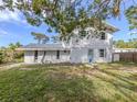 Exterior rear view of home showing the backyard and blue door at 200 Sierra S St, Nokomis, FL 34275
