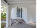 Covered entrance features stone flooring and decorative security door at 200 Sierra S St, Nokomis, FL 34275