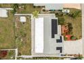 Bird's eye view showing the home's layout, roof with solar panels, and outdoor shed at 379 Peppertree Rd, Venice, FL 34293