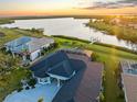Aerial view of the home showcasing its location on the water with a dock and easy Gulf access at 5035 Collingswood Blvd, Port Charlotte, FL 33948