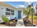 Charming home exterior with a decorative walkway and freshly manicured landscaping at 507 Buena Vista Dr, Nokomis, FL 34275