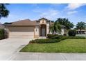 Charming one story home with a well maintained lawn and a two car garage at 5255 Layton Dr, Venice, FL 34293