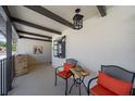 Cozy outdoor patio with decorative lights and comfortable seating at 764 Avenida Estancia # 212, Venice, FL 34292