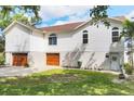 Attractive home with a three-car garage, lush lawn, and beautifully designed architecture at 1500 Lemon Bay Dr, Venice, FL 34293