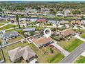 Expansive aerial view of home featuring a private pool, canal access, and lush landscaping at 1537 Overbrook Rd, Englewood, FL 34223