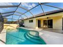Inviting screened-in pool area featuring clear blue water, a sun deck, and views of the backyard at 2094 Mesic Hammock Way, Venice, FL 34292