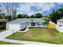 Charming single-story home with a well-maintained lawn, tidy landscaping, and attached garage at 4068 Palau Dr, Sarasota, FL 34241