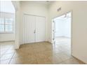 Spacious foyer with light tile floors leads to bedrooms and a bonus room at 5384 Layton Dr, Venice, FL 34293