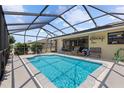 Inviting screened-in pool area, perfect for relaxation and outdoor enjoyment at 11153 Deerwood Ave, Englewood, FL 34224