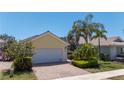 Inviting single-story home featuring a two-car garage, tidy landscaping, and a paved brick driveway at 13415 Coluccio St, Venice, FL 34293