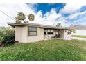 Charming single-story home featuring a manicured lawn, a welcoming entrance, and clean, neutral colors at 1609 Kirkwood St, North Port, FL 34288