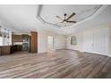 Open-concept living space with wood flooring, recessed lighting, and a modern ceiling fan at 172 Berthoud St, Port Charlotte, FL 33953