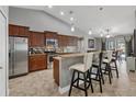 Kitchen boasts stainless steel appliances, wood cabinets, and a breakfast bar with seating at 194 Sportsman Rd, Rotonda West, FL 33947