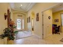 Inviting foyer leading to a bedroom and an entryway with a view of the front door at 2542 Cortenova Ct, Venice, FL 34292