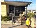 Cozy covered porch with seating area and charming outdoor decor at 262 Mariner Dr, North Port, FL 34287