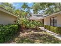 Charming home featuring lush landscaping, walkway, and a welcoming entrance at 269 Southampton Dr # 303, Venice, FL 34293