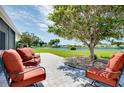Inviting back patio with comfortable seating and scenic water views, perfect for outdoor relaxation at 553 Circlewood Dr # T11, Venice, FL 34293
