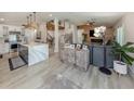 Open-concept living space featuring modern decor and a spacious kitchen view at 616 Gardenia Dr, Venice, FL 34285