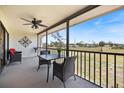 Screened lanai with golf course views offers a perfect spot for relaxing or outdoor dining at 726 Bird Bay W Dr # 153, Venice, FL 34285