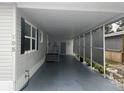 Covered carport area offering ample space for parking and protection from the elements at 795 Cervina N Dr, Venice, FL 34285