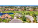Desirable home in golf community with pond, landscaped yard, manicured green spaces, and serene neighborhood at 854 Blue Crane Dr, Venice, FL 34285