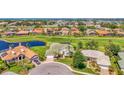 Lovely home in golf community with a pond view, beautiful landscaping, and well-maintained green spaces at 854 Blue Crane Dr, Venice, FL 34285