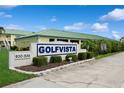 Golfvista community sign surrounded by well-maintained landscaping and lush greenery at 930 Capri Isles Blvd # 120, Venice, FL 34292