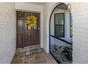 Inviting front entrance featuring a decorative wreath and tiled entryway at 1231 Pine Needle Rd, Venice, FL 34285