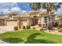 Charming single-Gathering home with well-manicured lawn, mature trees and lush landscaping at 1241 Creek Nine Dr, North Port, FL 34291