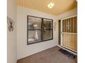 Inviting entrance features a secure decorative door and a large window with privacy blinds at 229 Southampton Drive # 290, Venice, FL 34293