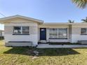 A well-maintained home with a charming facade, featuring a manicured lawn and inviting curb appeal at 444 Driftwood Rd, Venice, FL 34293